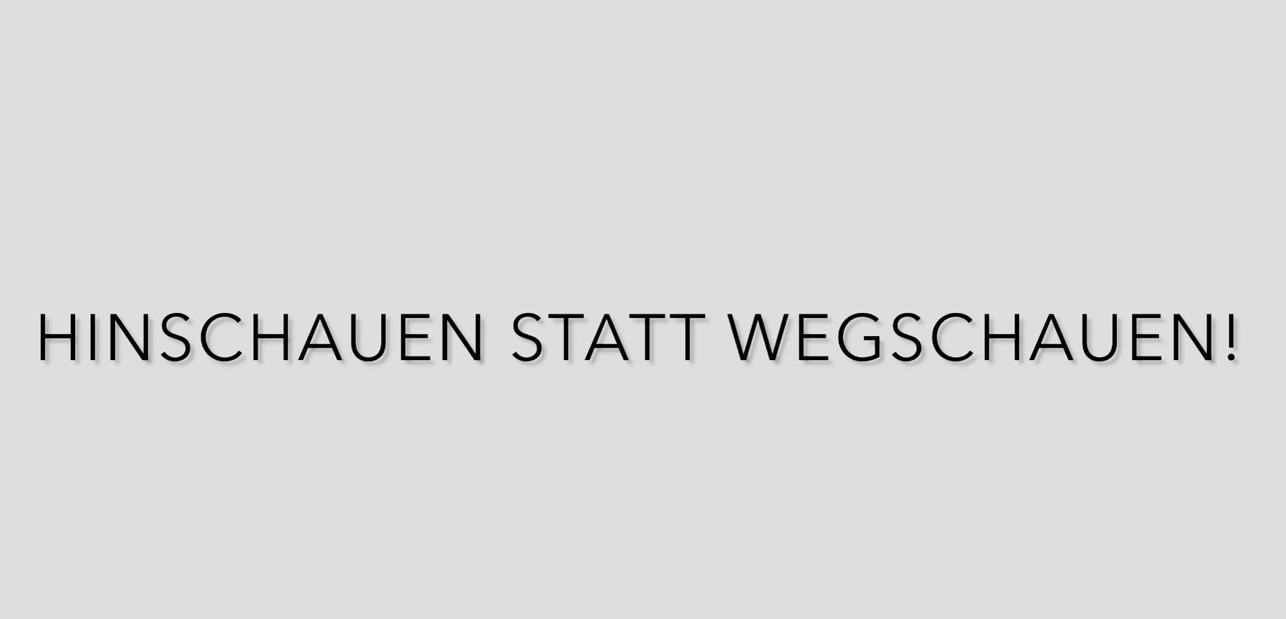 Der Schriftzug „HINSCHAUEN STATT WEGSCHAUEN!“ fordert zum aktiven Handeln und Bewusstsein auf.